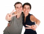 Sisters Showing Victory Sign Stock Photo