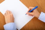 Female Hand Signing Contract Stock Photo