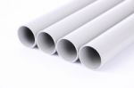 Steel Pipes Cut Front Focus Row On White Floor Stock Photo