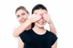 Girl In Playful Mood Teasing Her Friend Stock Photo