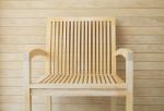 Wooden Chair With Wooden Wall In Background Stock Photo