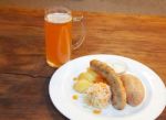 Sausages With Vegetables And Mug With Beer Stock Photo