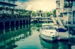 White Speed Boat At The Pier, Vintage Style Photograph Stock Photo