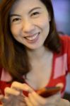 Smile Asian Woman Have Fun With Mobile Phone Stock Photo