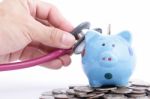 Blue Piggy Bank With Stethoscope Stock Photo