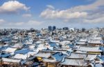 Roof Of Jeonju Traditional Korean Village Covered With Snow, Jeonju Hanok Village In Winter, South Korea Stock Photo