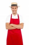 Young Chef Wearing Straw Hat Stock Photo