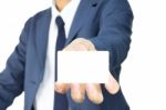 Businessman Hold Business Card Or White Card At Low Level Stock Photo