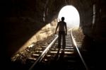 Man Standing In Train Tunnel Stock Photo