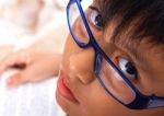 Brainy School Kid Reading A Book Stock Photo