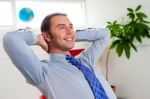 Young Businessman Relaxing And Day Dreaming Stock Photo