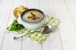 Mushroom Soup With A Bread Roll And Parsley Stock Photo