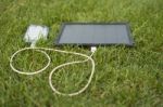 Mobile Phone Charging With Solar Energy - Charger Stock Photo