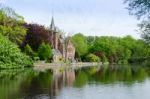 Flemish Style Building Reflecting In Minnewater Lake Stock Photo