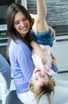 Mother And Daughter Having Fun In The Kitchen Stock Photo