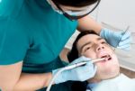 Man Getting A Dental Checkup Stock Photo