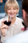 Couple Sipping Red Wine And Cherishing Memories Stock Photo