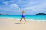 Girl Jumping With Happy On The Beach At Thailand Stock Photo