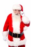 Santa Claus Adjusting His Spectacles Stock Photo