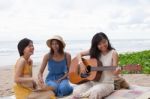 Portrait Group Of Young Asian Woman Playing Guitar In Sea Beach Picnic Party At Sea Side With Happiness Face Emotion Stock Photo