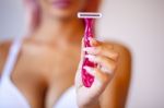 Pink Hair Attractive Woman Hold Pink Female Shaver In Hand Stock Photo