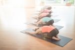 Asian Woman Doing Yoga Indoors Stock Photo