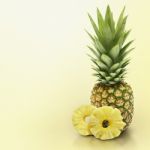 Pineapple On Yellow Solid Background Stock Photo