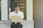 Senior Asian Woman Celebrate With Laptop Stock Photo