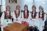 Group Of Youmg Ladies In Full Polish National Costume Stock Photo