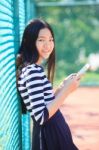 Asian Girl And Computer Tablet In Hand Standing With Toothy Smiling Face Use For People And Internet Connecting ,communication In Modern Digital Lifestyle Stock Photo