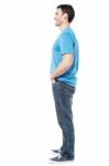 Full Length Of Casual Man Posing Side Ways Stock Photo