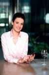 Corporate Lady Messaging Through Mobile Phone Stock Photo