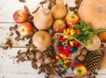 Basket With Halloween Candy And Autumn Decorations Stock Photo