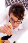 High Angle View Of Female Student Pointing With Pencil Stock Photo