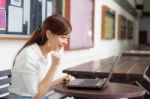 Portrait Of Thai Adult Businesswoman Beautiful Girl Using Computer Notebook Stock Photo