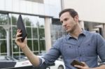 Man Holding I-pad Tablet Computer Stock Photo