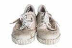 Close Up A Pair Of Dirty Sneakers Isolated On White Background Stock Photo