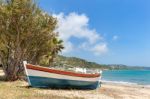 Colorful Boat Lying On Greek Beach Stock Photo