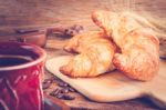 Continental Breakfast With Coffee And Croissant Stock Photo