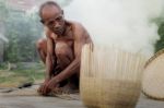 Old Man And Baskets Stock Photo