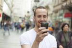 Man In Street With Cell Phone Stock Photo