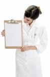 Lady Doctor Looking In Clipboard Stock Photo