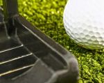 Putting A Golf Ball Stock Photo