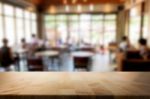 Selected Focus Empty Brown Wooden Table And Coffee Shop Or Resta Stock Photo