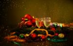 Two Glasses Of Champagne With A Christmas Decor In The Background Stock Photo