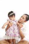 Mom Is Holding And Playing With Her Baby On White Background Stock Photo