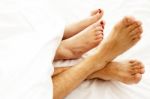 Bare Feet Of Couple Stock Photo