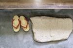 Pair Of Japanese Traditional Shoe On Stone Floor Stock Photo