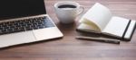 Office Desk With Laptop And Coffee Cup Stock Photo