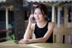 Portrait Of Thai Adult Student University Beautiful Girl Calling Smart Phone Stock Photo